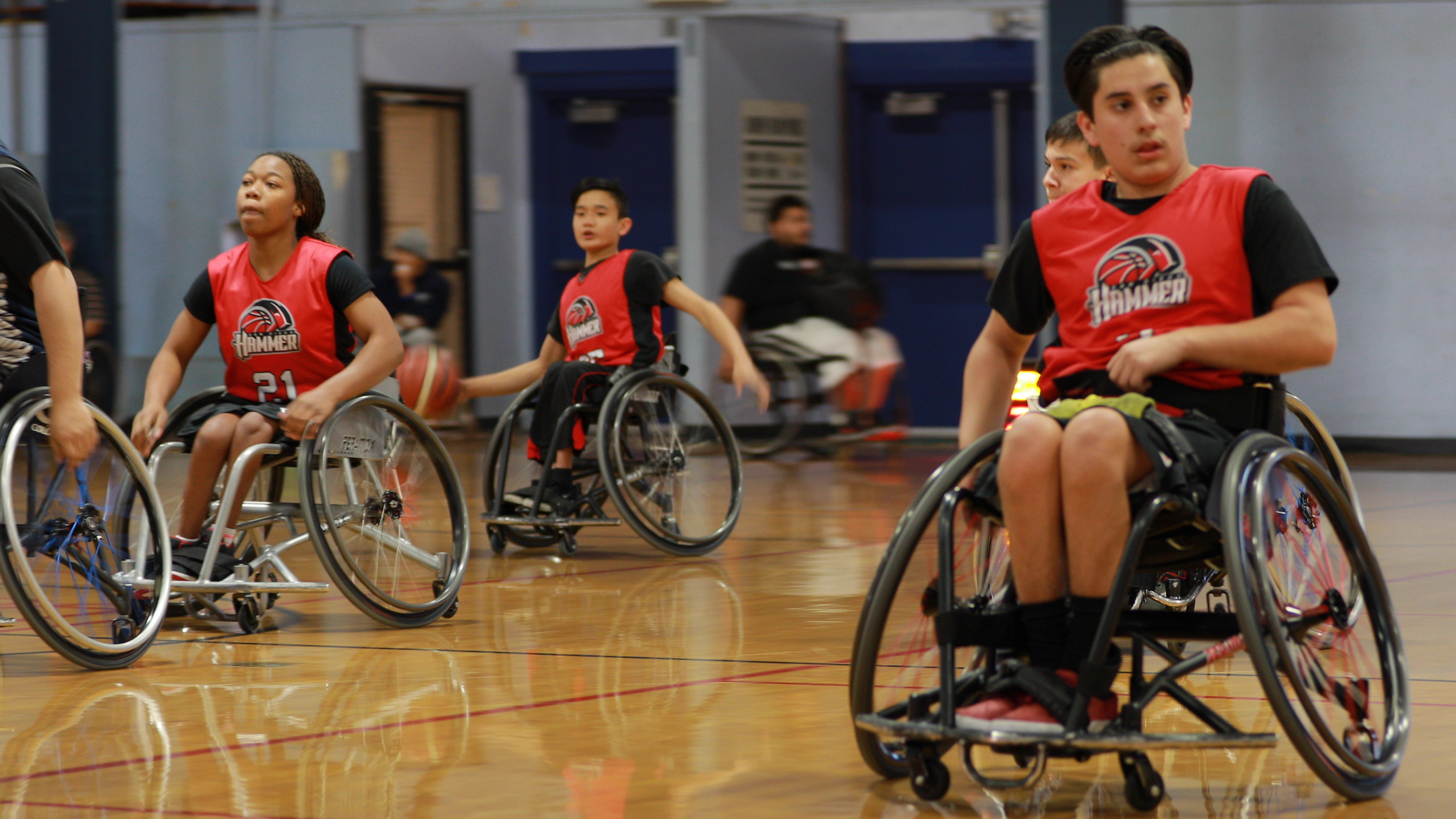 Danny playing wheelchair basketball.