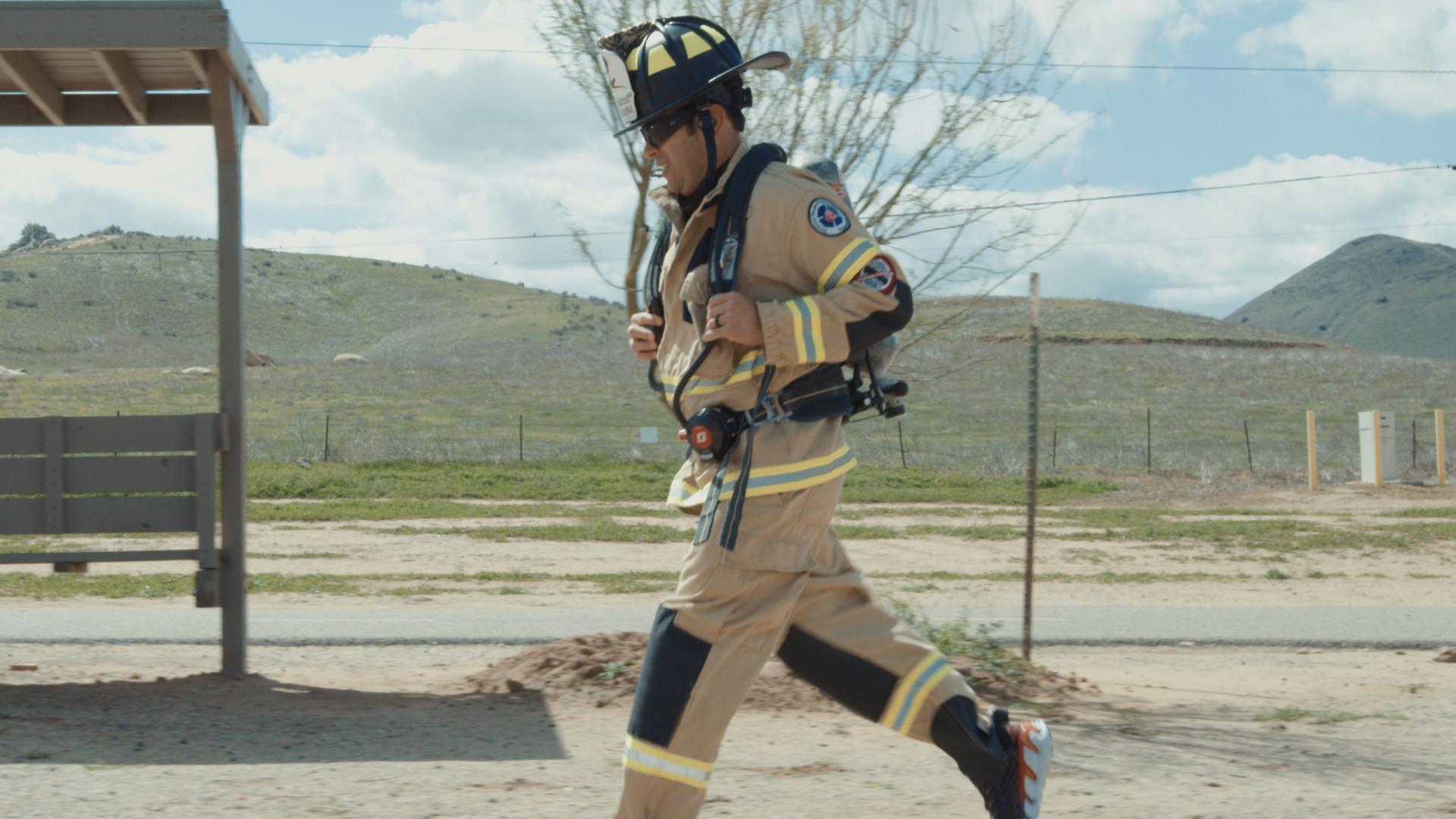 Jose Zambrano running in his firefighter gear.