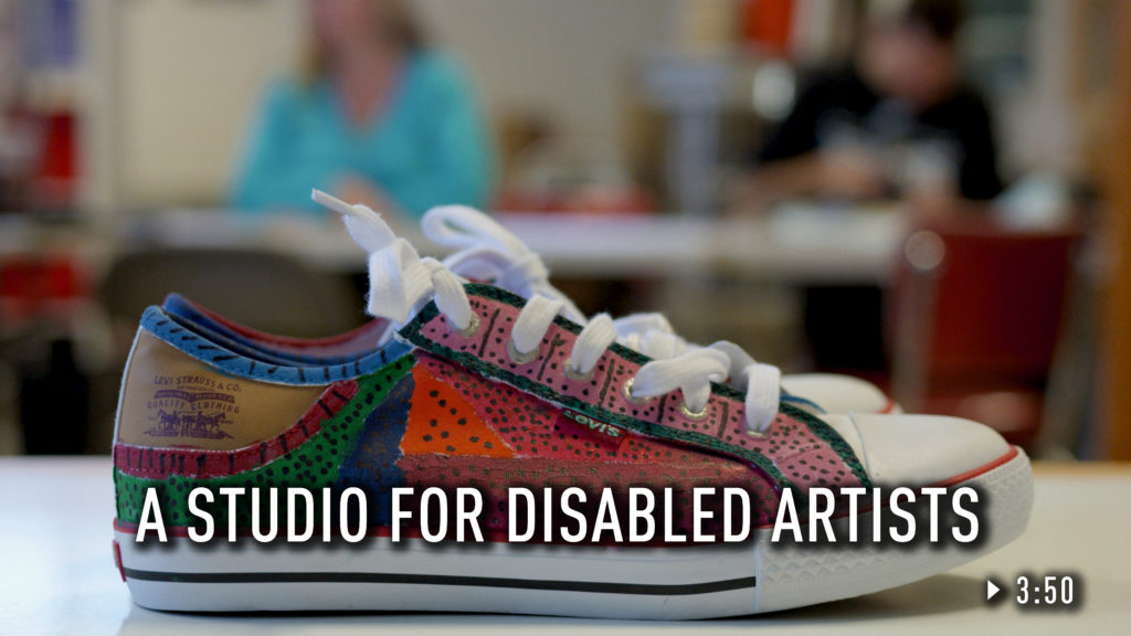 A sneaker painted by an artist at Kindling Studios.